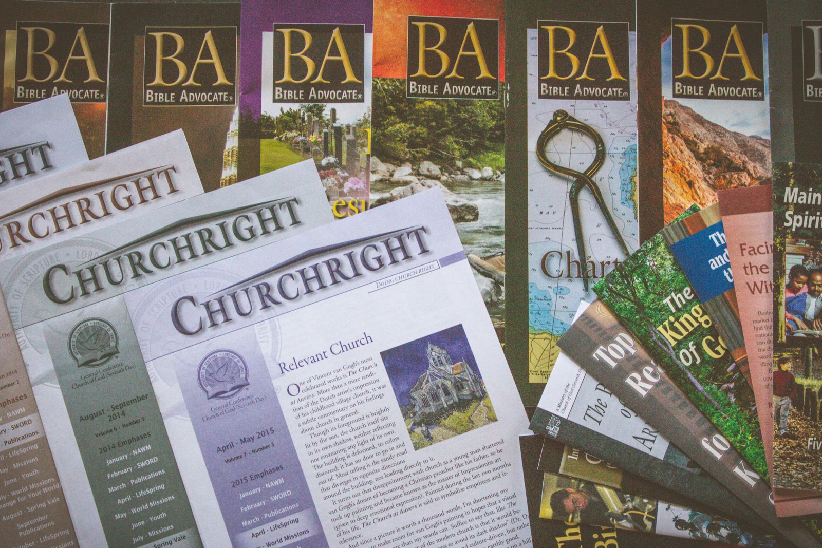 Printed materials laid out together including Churchright, BA, and various tracts