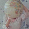 person holding a globe