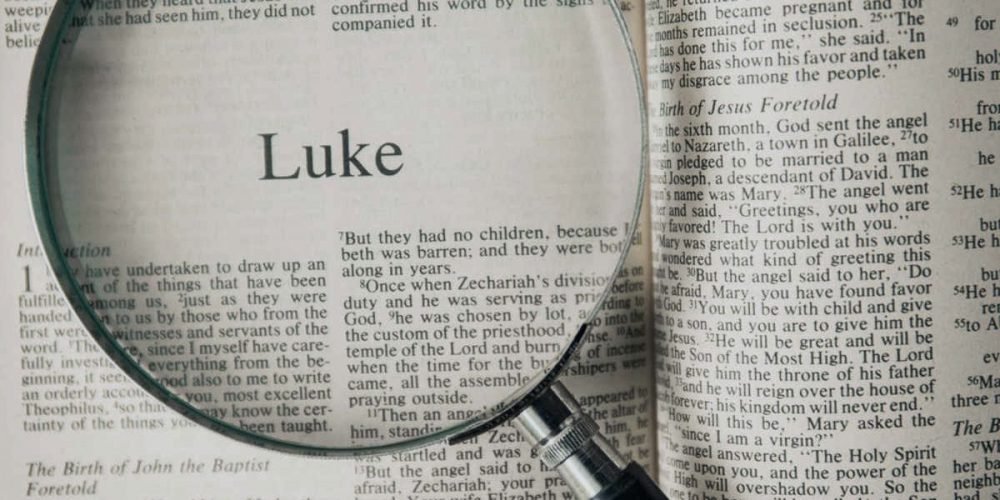 Bible opened to the Gospel of Luke