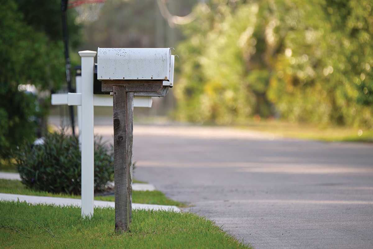 Typical american outdoors mail box on suburban street side