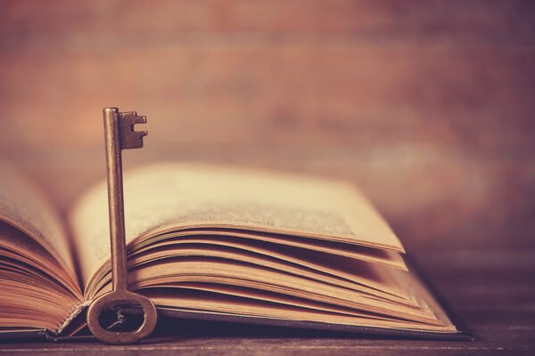 Retro key and opened book