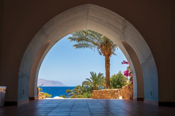 Beautiful arched doorway in a building on the shores of the Red Sea at morning in the resort town of Sharm El Sheikh, Egypt, Africa